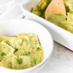 Baked Spinach Ravioli with Pesto Cream Sauce